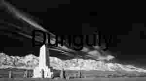 Black and White Monument with Japanese Inscription — Snow‑Covered Mountain Backdrop