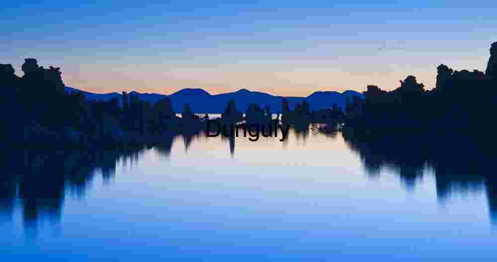 Twilight Mirror: Tufa Silhouettes and Mountain Shadows at Mono Lake