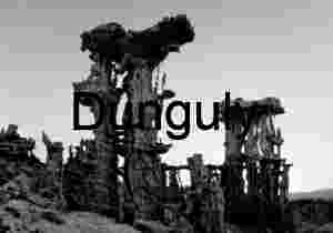 Stone Sentinels: Vertical Tufa Towers Beneath a Clear Twilight Sky