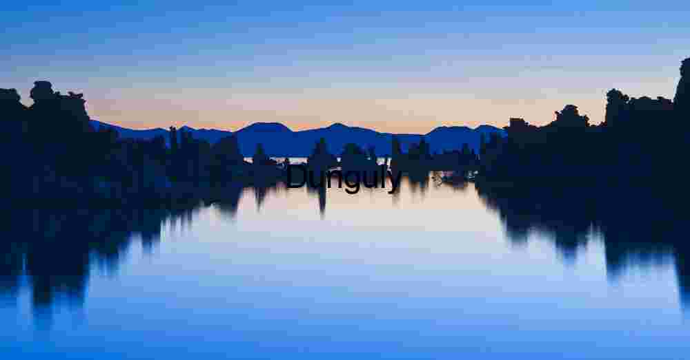 Twilight Reflections at Mono Lake: Tufa Silhouettes and Mountain Shadows