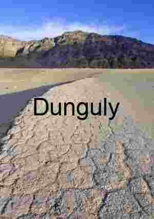 Cracked Silence: Parched Earth Beneath Mountain Shadows