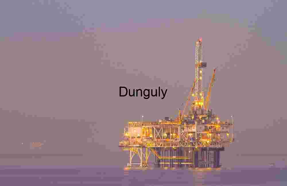 Twilight Sentinel: Offshore Oil Rig Illuminated at Sea
