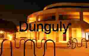 Architectural Atmosphere  Modern Circular Building Illuminated at Night with Warm Orange Glow