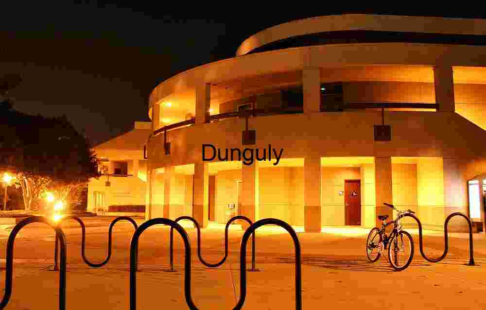 Architectural Atmosphere Modern Circular Building Illuminated at Night with Warm Orange Glow