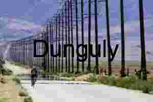 Cyclist on Desert Road Beneath Power Lines and Mirage
