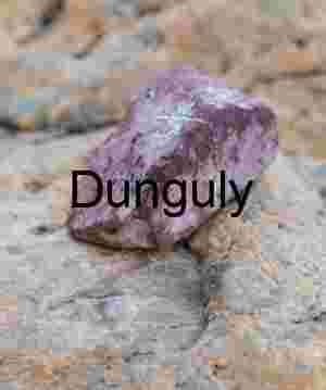 Purple Mineral Rock on Weathered Stone Surface – Geological Macro Study