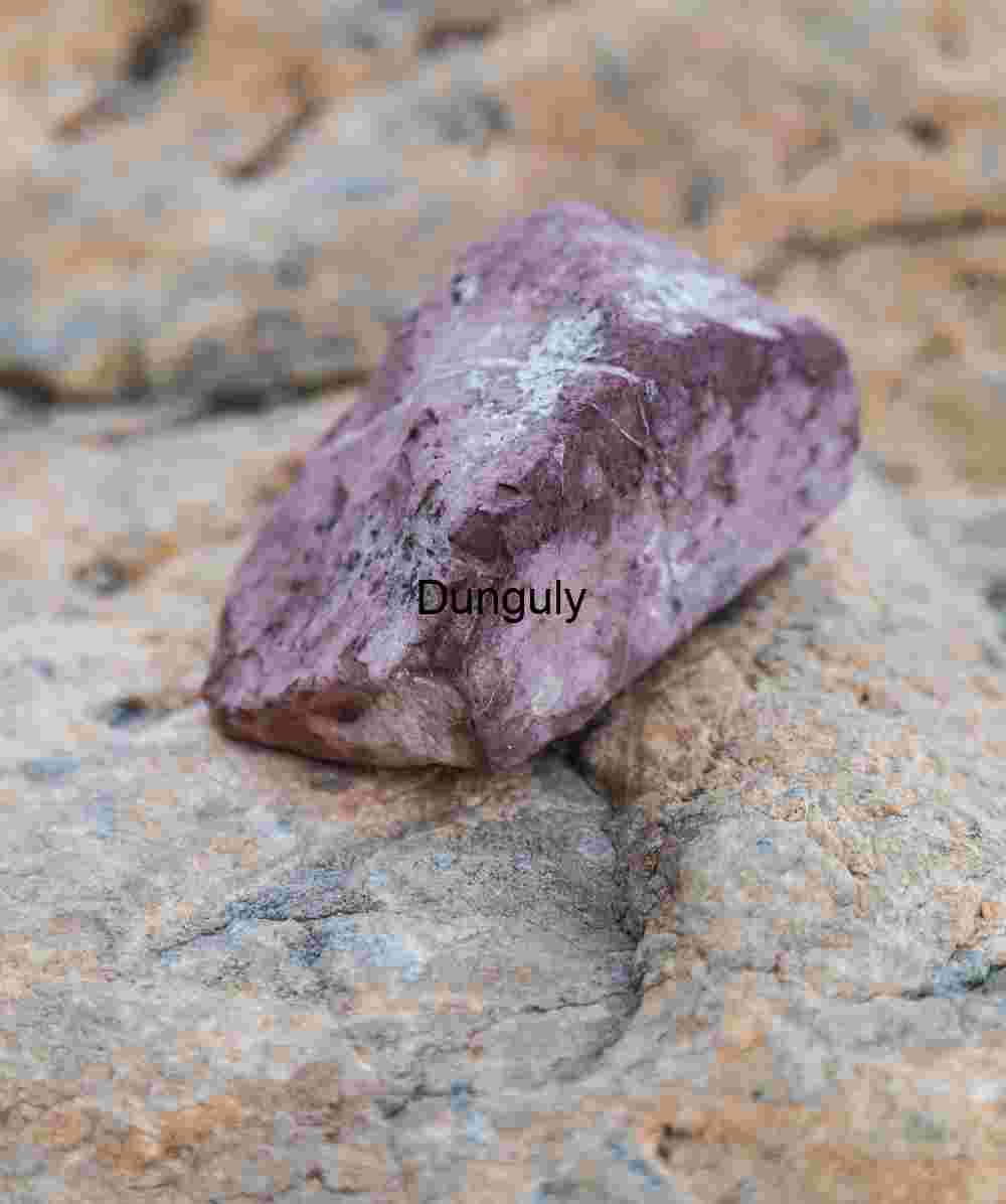 Purple Mineral Rock on Weathered Stone Surface – Geological Macro Study