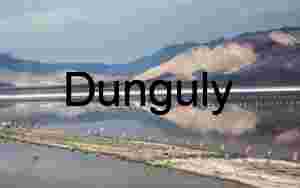 Symmetry of Weathered Wooden Posts Extending into Horizon