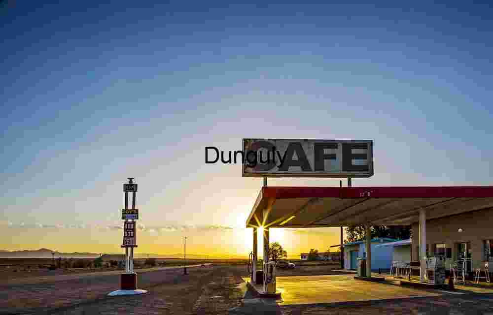 Sunset Glow Over Desert Café and Gas Station in Remote Landscape