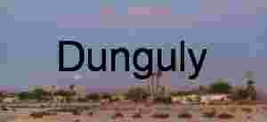 Moonrise Over Desert Townscape at Twilight