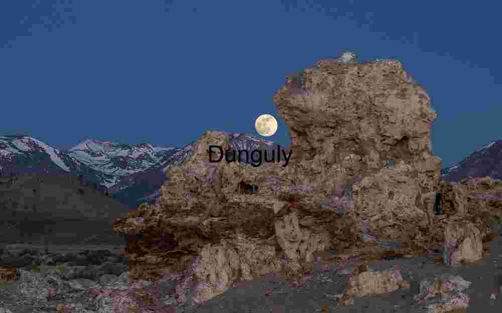 Moonrise Over Stone: Alpine Silence Beneath Lunar Light