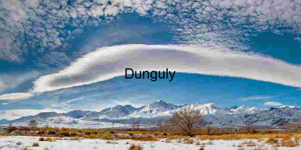 Atmospheric Wave: Snowy Peaks Beneath a Curved Cloud Formation