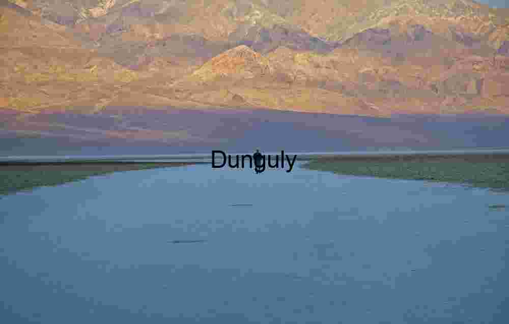 Toward the Divide: Walking the Salt Flat Beneath Painted Peaks