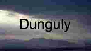 Sunlight Breaking Through Clouds Over Mountain Landscape