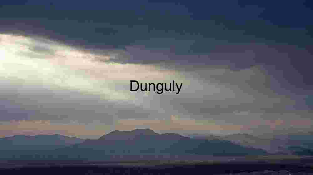 Sunlight Breaking Through Clouds Over Mountain Landscape