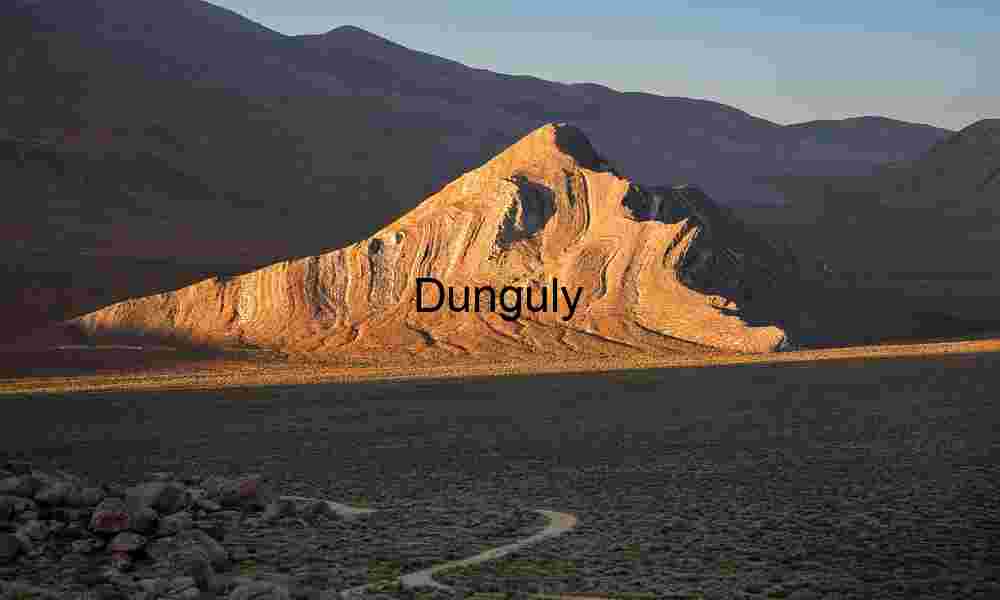 Tilted Earth: Striated Peak Rising from the Desert Floor
