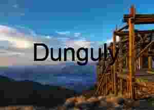 Weathered Wooden Mining Structure Overlooking Mountain Valley at Sunset