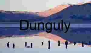 Reflective Mountain Lake with Weathered Wooden Posts