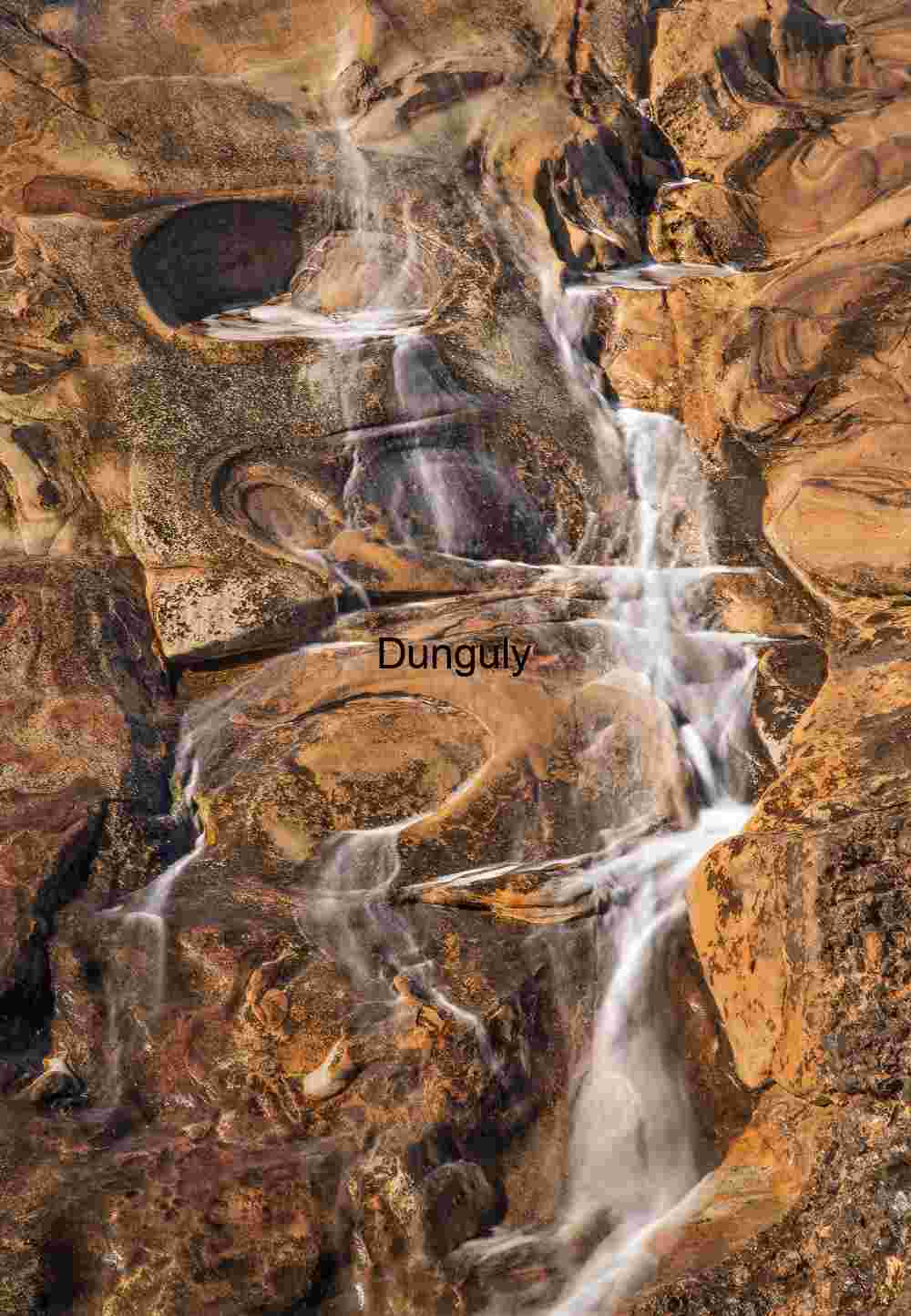 Powerful Ocean Waves Washing Over Stony Shoreline
