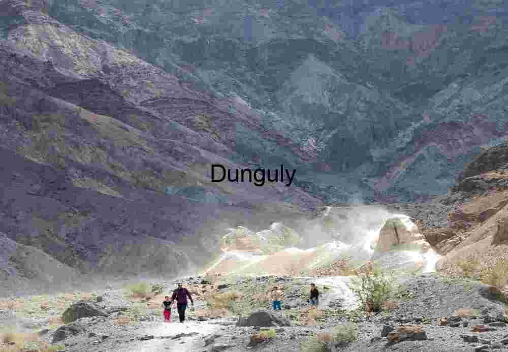 Trail Through Time: Hikers in a Painted Desert Canyon