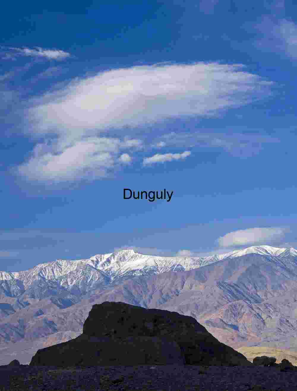 Stone and Snow: Alpine Contrast Beneath a Painted Sky