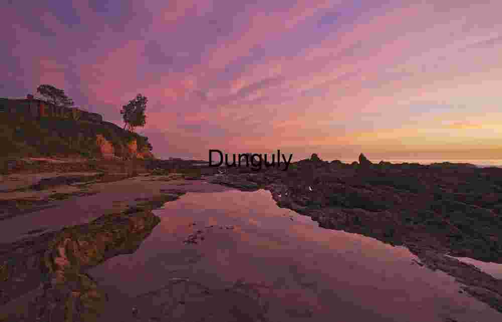 Dramatic Coastal Sunset with Rocky Shoreline