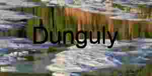 Fractured Reflections: Ice Floats Beneath Painted Cliffs