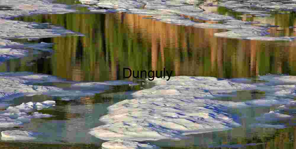 Fractured Reflections: Ice Floats Beneath Painted Cliffs