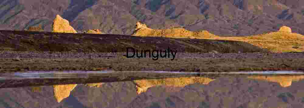 Serene Desert Landscape – Warm Light over Rugged Formations