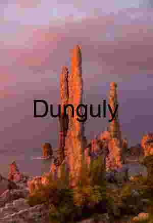 Sunlit Sentinels: Tufa Towers Framed by Earth and Sky