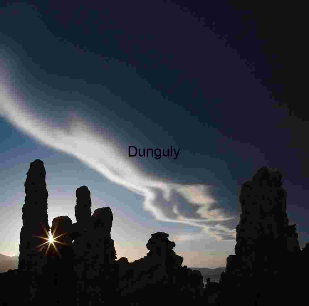 Tufa Tower Silhouettes with Sunburst and Sweeping Clouds at Mono Lake