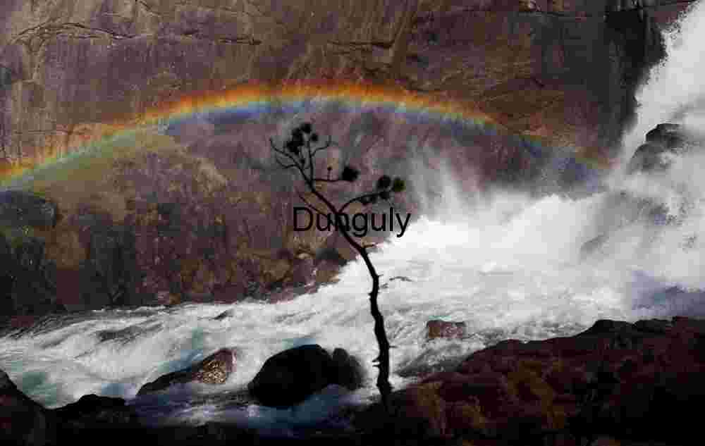 Arc of Mist: Rainbow Over Thunderous Falls