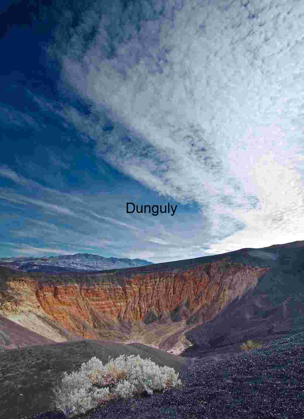 Crater of Color: Stratified Earth Beneath Streaked Skies
