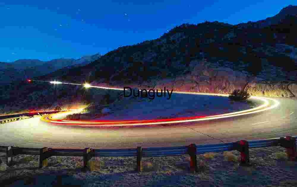 Winding Mountain Road at Night – Light Trails and Scenic Curves in Long Exposure