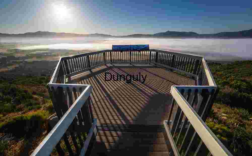 Foggy Mountain Overlook Platform with Valley Clouds and Sunlit Peaks