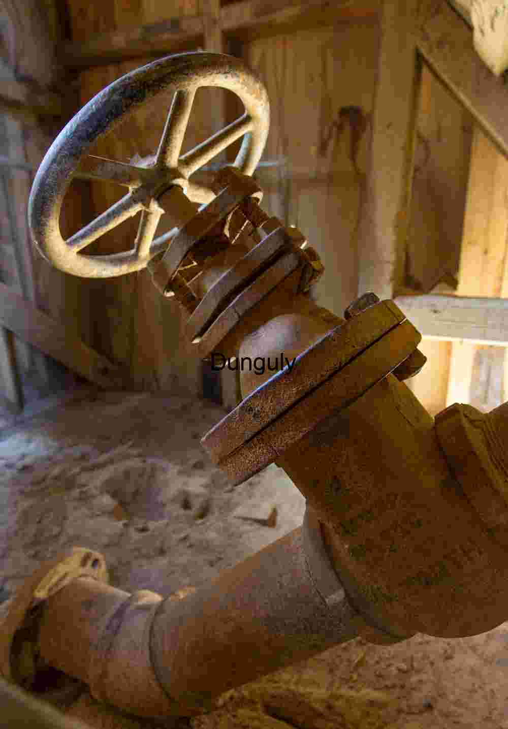 Rusted Industrial Valve in Weathered Utility Shed