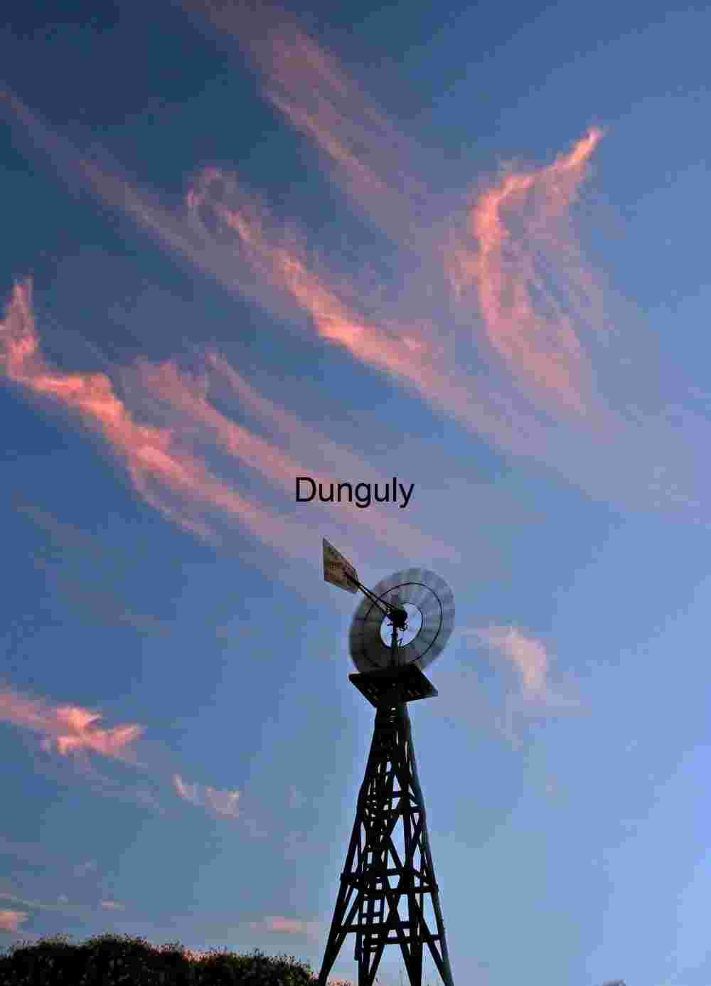 Traditional Windmill Silhouette Against Colorful Sky