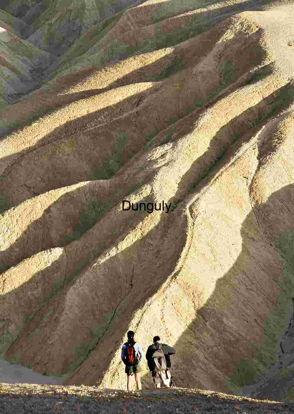 Erosion and Scale: Explorers Beneath Sculpted Ridges