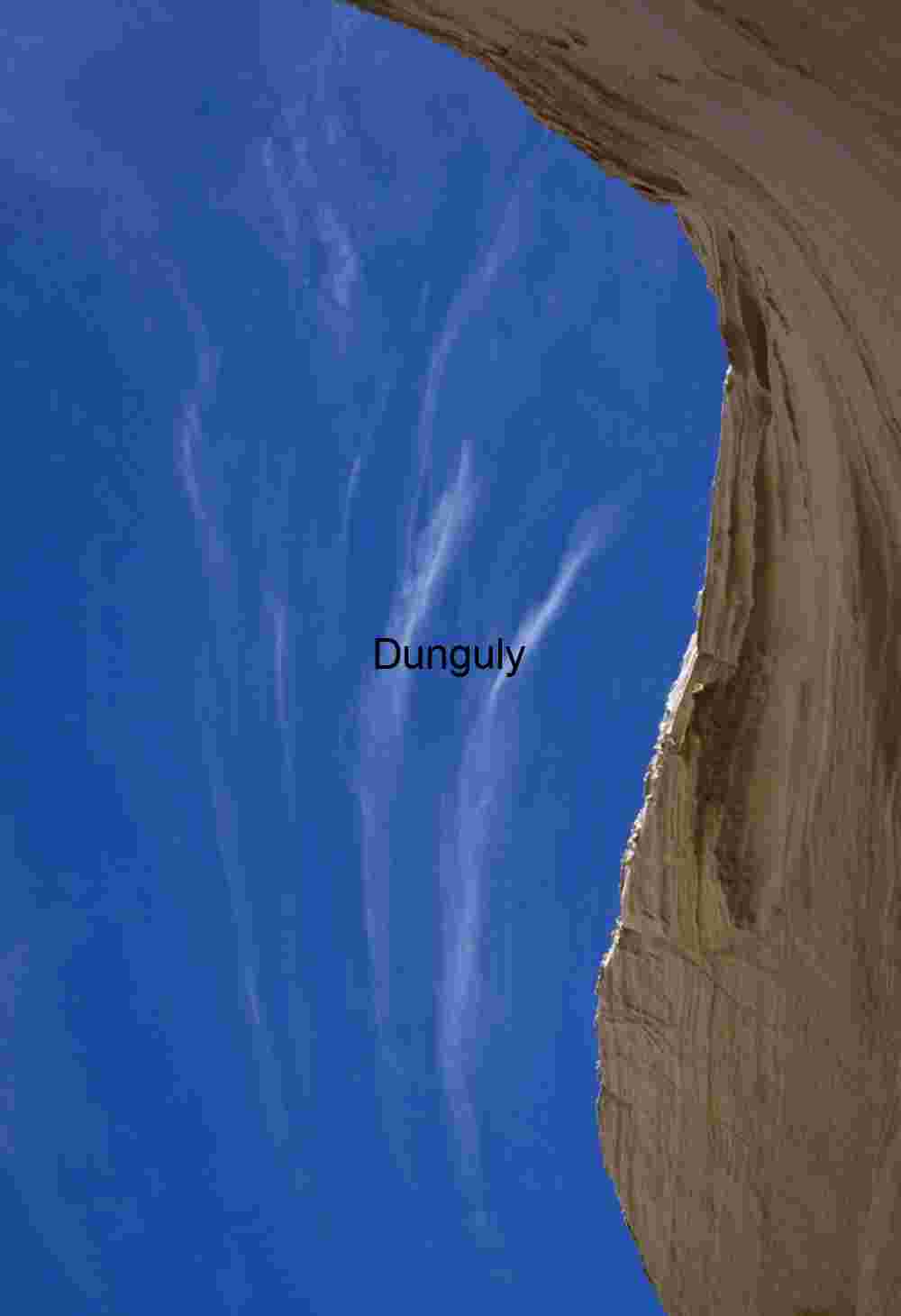Blue Sky and Cirrus Clouds Framed by Wavy Sandstone