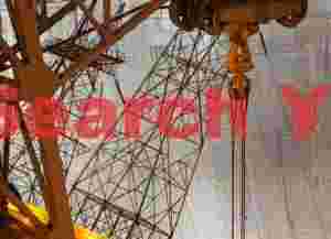 Transmission Towers and Crane Against Hoover Dam Face