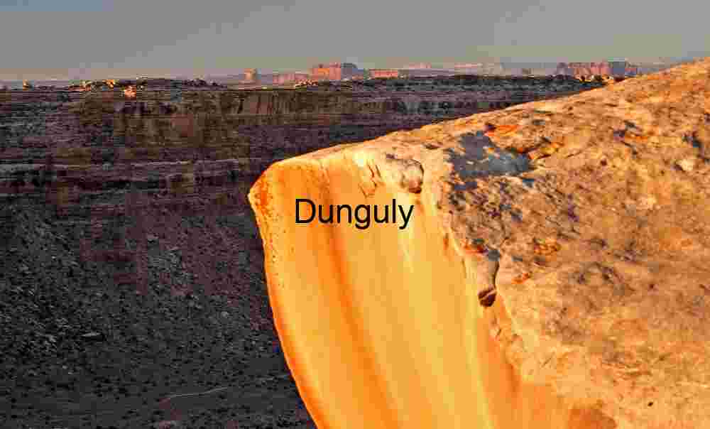 John's Canyon Dawn: Golden Light on Desert Sandstone Cliff