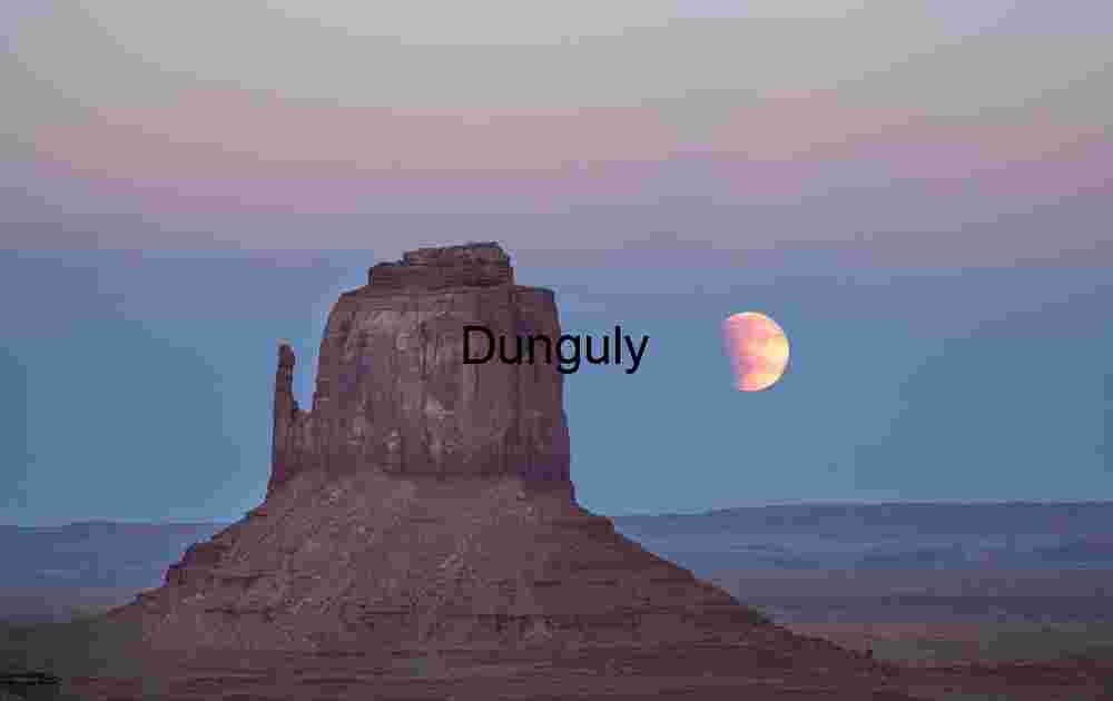 Partially-eclipsed moon rising by East Mitten