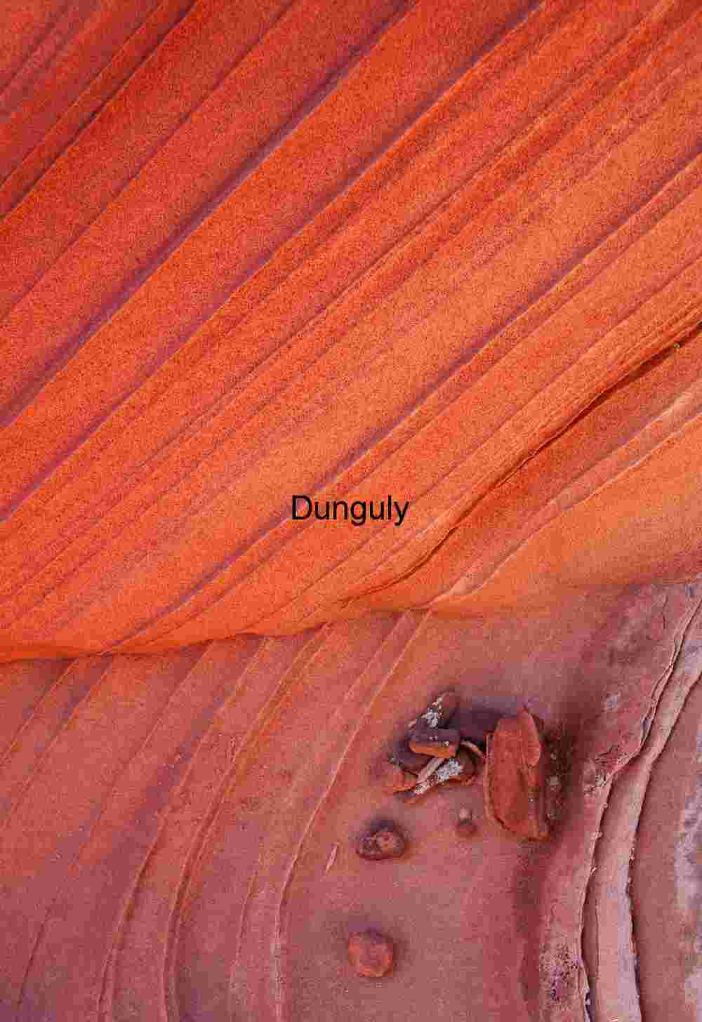 Red pebbles and striated rock, South Coyote Buttes