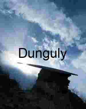 Dramatic Silhouette of Mortar Board Rock Against Sunburst Sky