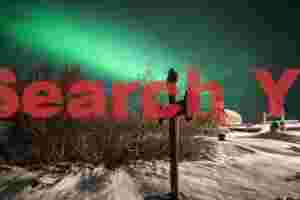 Aurora Illuminating Memorial Cross at Þingvellir