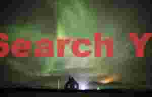 Aurora over floodlit church; Búðir, Snaefellsnes peninsula