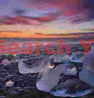 Glacial Ice Formation at Bergs reflecting sunset sky