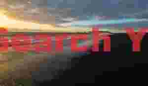 Black sand beach with distant Dyrholaey