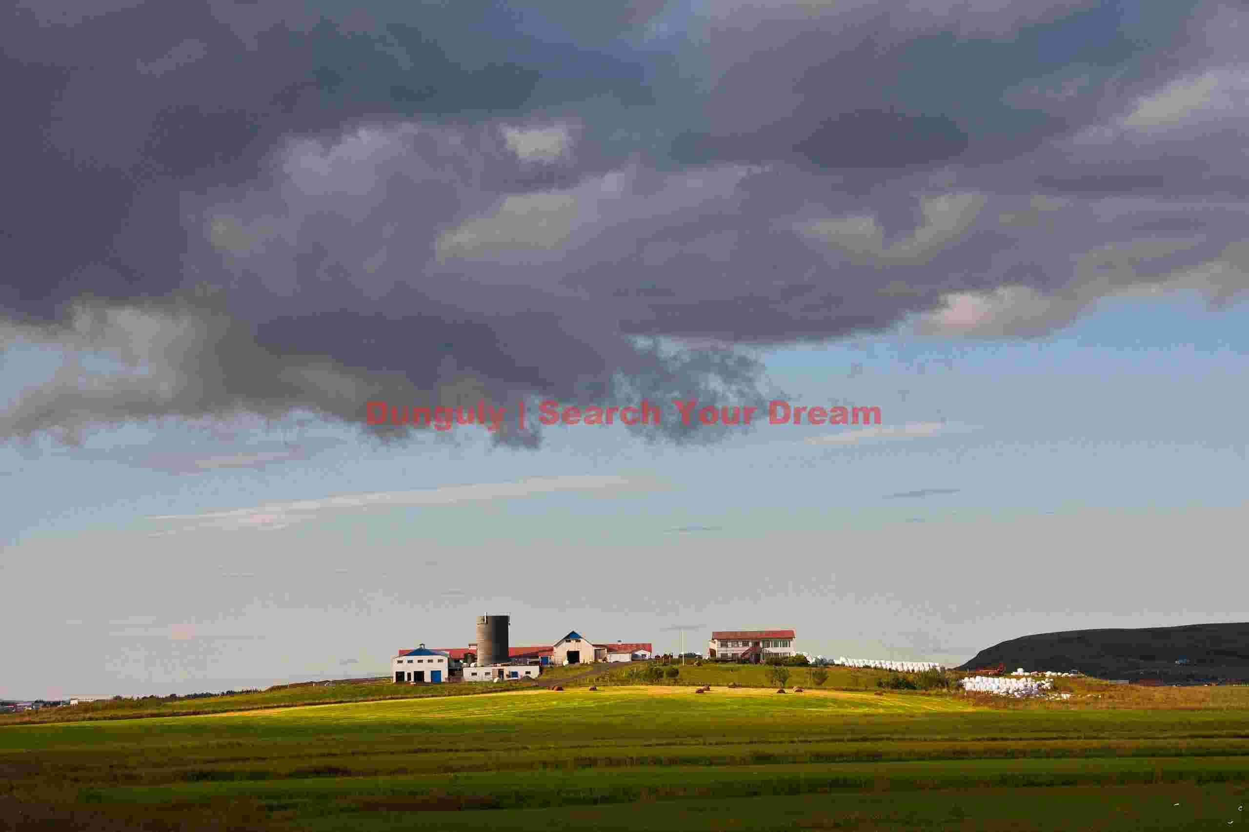Clouds over farm, South Iceland