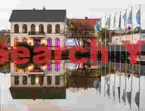 Colorful house and flagpoles; Reykjavík